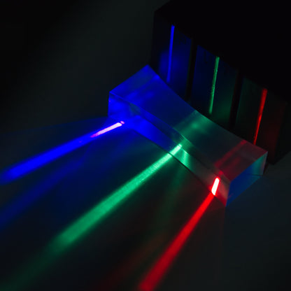 blue green and red ray box refracting through a double concave acrylic plastic lens for hands on science education