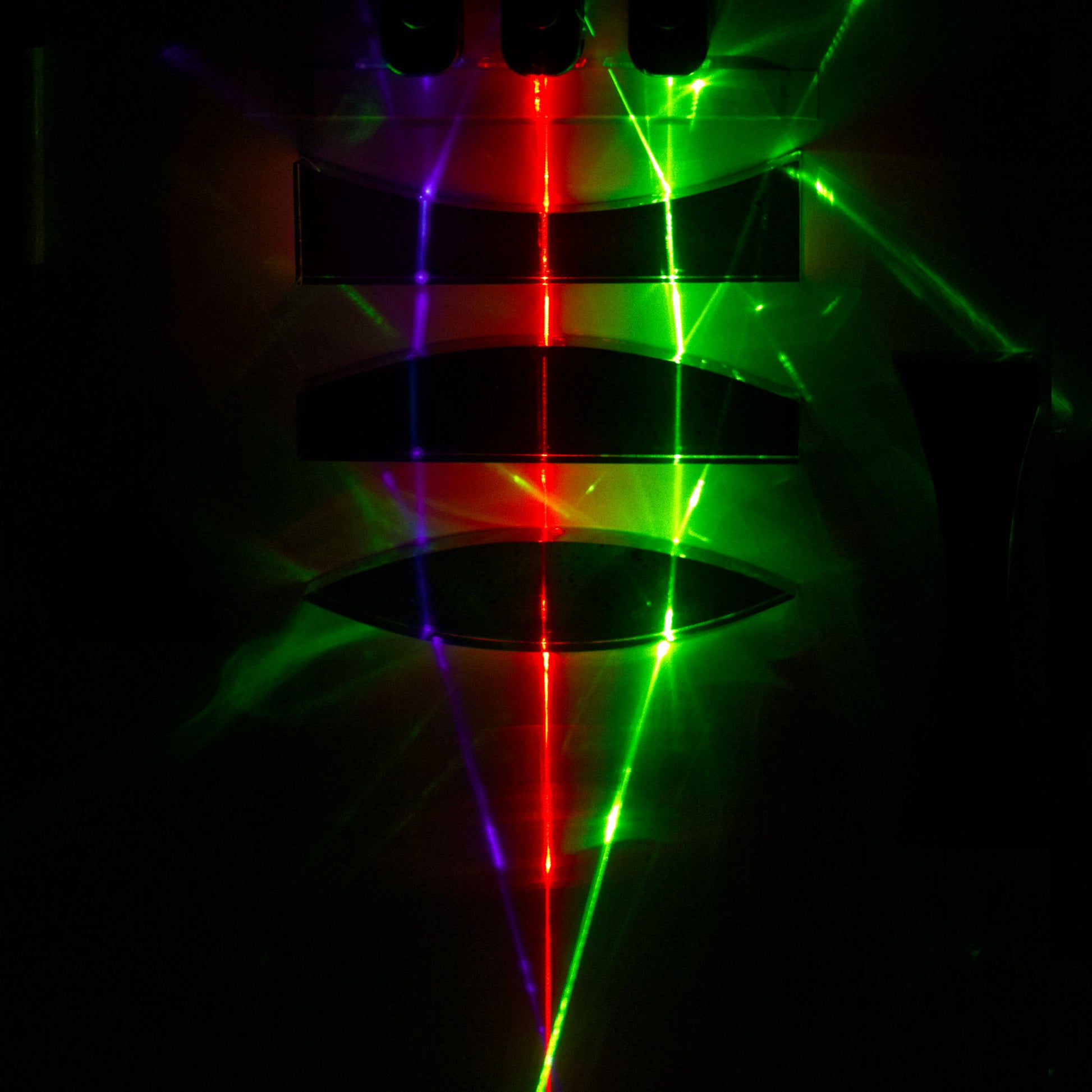 human eye focal distance classroom demonstration on white board with red green and blue lasers refracting through a concave, convex, and double convex lens to reach focus point using Laser Blox by Laser Classroom